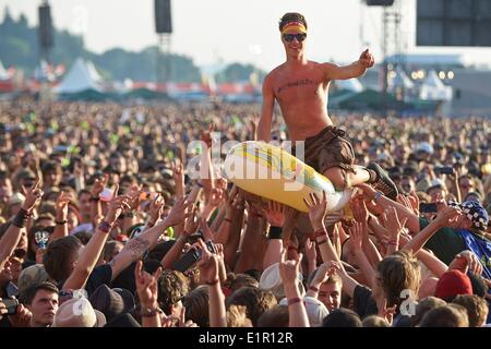 Nuerburg, Germany. 08th June, 2014. A fan crowd surfs in an inflatable during the 'Rock am Ring' music festival at the Nuerburgring near Nuerburg, Germany, 08 June 2014. The festvial is celebrating its 29th edition in 2014 before it will close doors for ever. PHOTO: THOMAS FREY/dpa/Alamy Live News Stock Photo