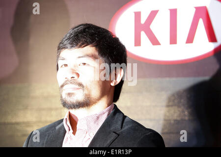 Manila, Philippines. 9th June, 2014. Makati, Philippines - Filipino boxing champion Manny Pacquiao arrives at a press conference in Makati, east of Manila on June 9, 2014. Manny Pacquaio was appointed as head coach of KIA, a new team joining the local professional basketball league in the Philippines. © Mark Cristino/NurPhoto/ZUMAPRESS.com/Alamy Live News Stock Photo