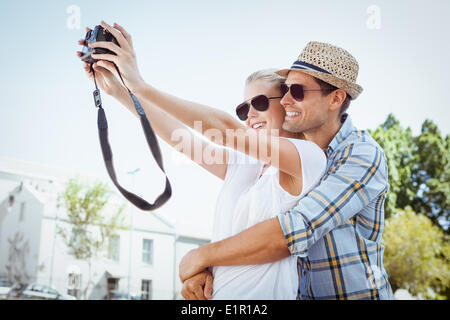 Stylish young couple taking a selfie Stock Photo