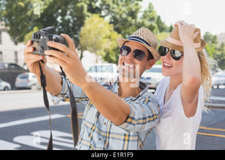 Young hip couple taking a selfie Stock Photo