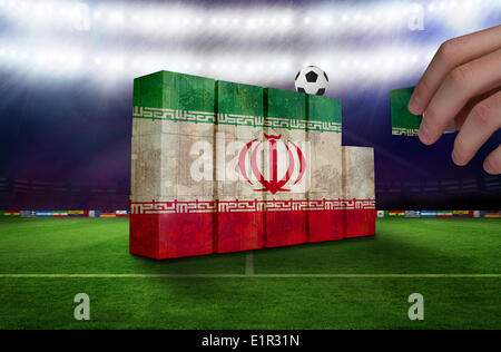 Composite image of hand building wall Stock Photo