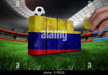 Composite image of hand building wall Stock Photo