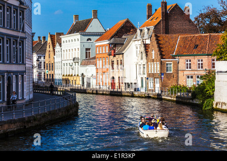 Tourist boat along the St. Annarei Canal in Bruges,(Brugge), Belgium Stock Photo