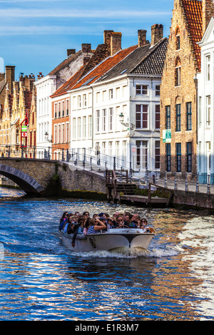 Tourist boat along the St. Annarei Canal in Bruges,(Brugge), Belgium Stock Photo