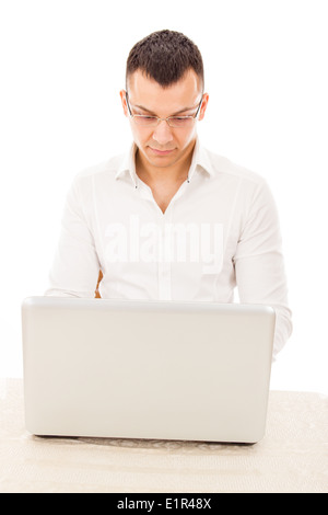 handsome man with glasses in a white shirt with laptop Stock Photo