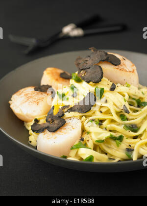 Pasta with scallops and truffles Stock Photo
