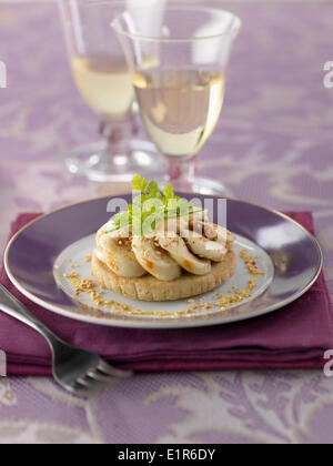 Shortbread topped with white sausage ,mustard and sesame sauce Stock Photo