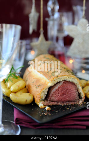 Beef Wellington with herbs and Ratte potatoes Stock Photo