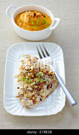 Sea bream with hazelnut crust,sweet potato mash Stock Photo