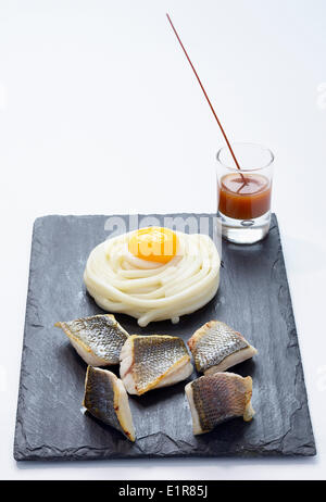 Sea bass fillet,Udon ,ginger and caramel sauce Stock Photo