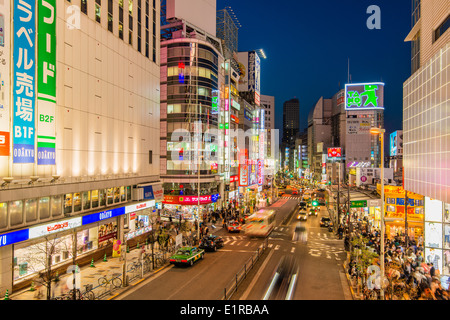 Night view over a busy street in Shinjuku district, Tokyo, Japan Stock Photo