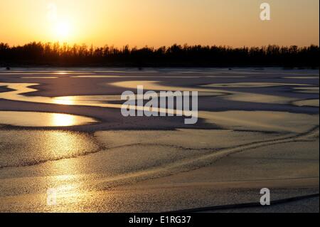 Frozen lake with evening light Stock Photo