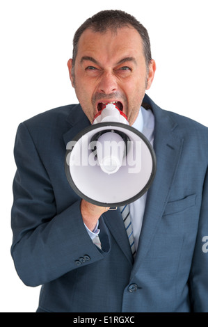 angry businessman shouting to camera through a loudhailer or megaphone Stock Photo
