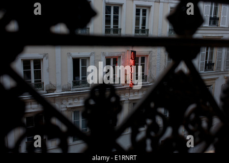 Neon sign outside the Amour Hotel at 8 rue Navarin, 9th Arrondissement, Paris, France. Stock Photo