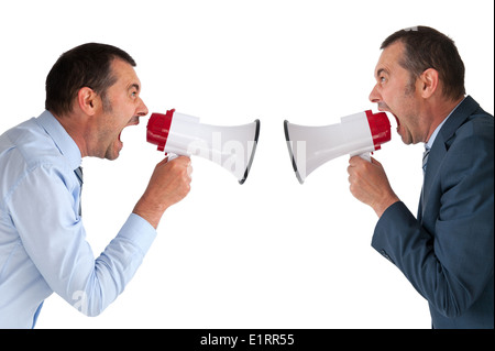 businessman yelling or shouting at himself through a loudhailer or megaphone isolated on white Stock Photo