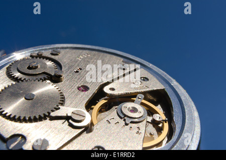old silver chrome stopwatch chronological timer jewels accurate back dial buttons inside cogs and wheels with an escapement Stock Photo