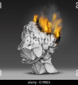 Headache and mental illness concept as a group of crumpled office paper shaped as a human head that is on fire burning away at the brain as a symbol and medical metaphor for emotional stress at work or degenerative dementia disease as alzheimers. Stock Photo