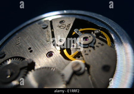 old silver chrome stopwatch chronological timer jewels accurate back dial buttons inside cogs and wheels with an escapement Stock Photo
