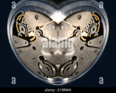 old silver chrome stopwatch chronological timer jewels accurate back dial buttons inside cogs and wheels with an escapement bot Stock Photo