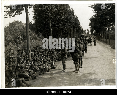 London Territorials resting on the march [Estaires La Bassée Road, France]. . Stock Photo