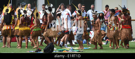 Santo Andre, Brazil. 09th June, 2014. Brazilian indigenous and Miroslav Klose (C) of Germany dance together during a training session of the German national soccer team at the training center in Santo Andre, Brazil, 09 June 2014. The FIFA World Cup will take place in Brazil from 12 June to 13 July 2014. Photo: Marcus Brandt/dpa/Alamy Live News Stock Photo