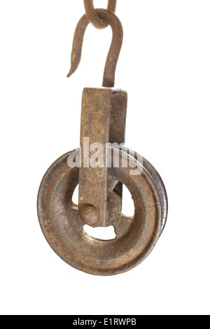 An old pulley used to draw water from wells. When attached to an immovable object (railing across a well) is a first class lever Stock Photo