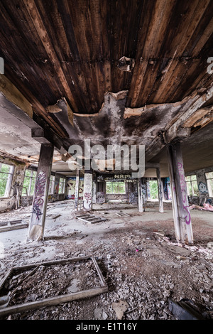Abandoned factory hall and burnt ceiling Stock Photo