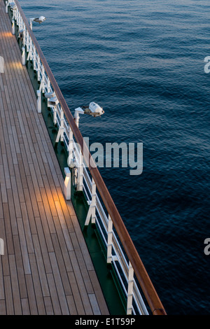 Empty deck on MV Arcadia in the evening shortly before sunset as she sails through the North Sea. Stock Photo