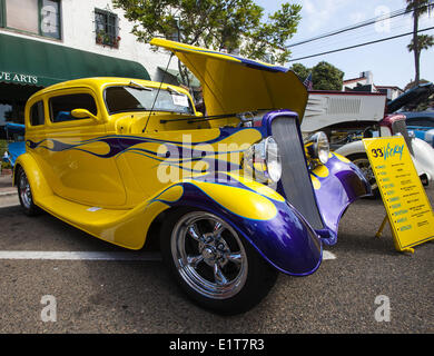 San Clemente, California, USA. 8th June, 2014. A yellow 1933 Ford Vicky Hot Rod Coupe with purple flames and mag wheels. The 19th Annual 2014 San Clemente Car Show featuring new and old classic and exotic cars and trucks took over the downtown along Avenida Del Mar on Sunday, June 8, 2014. The one day event brings car collectors and enthusiasts from all over southern California. Credit:  David Bro/ZUMAPRESS.com/Alamy Live News Stock Photo