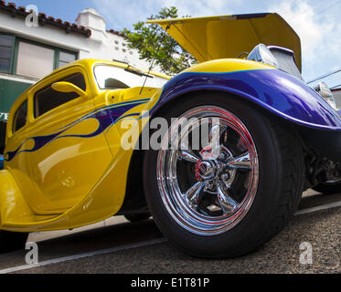 San Clemente, California, USA. 8th June, 2014. A yellow 1933 Ford Vicky Hot Rod Coupe with purple flames and mag wheels. The 19th Annual 2014 San Clemente Car Show featuring new and old classic and exotic cars and trucks took over the downtown along Avenida Del Mar on Sunday, June 8, 2014. The one day event brings car collectors and enthusiasts from all over southern California. Credit:  David Bro/ZUMAPRESS.com/Alamy Live News Stock Photo