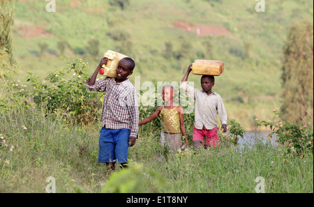 Children collect water in the Nyagatare district of Rwanda, east Africa Stock Photo