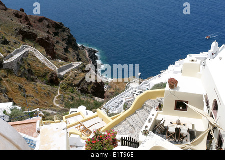 View on blue bay with boats on Santorini Island in Greece. Stock Photo