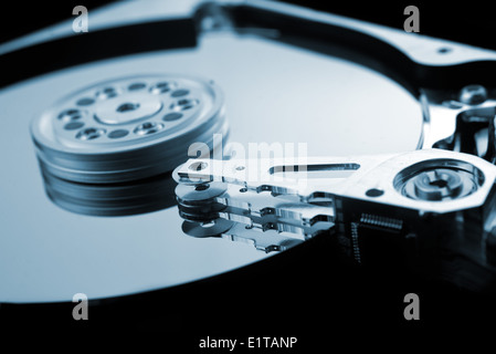 Computer hard disk close up detail with selective focus and shallow depth of field. Computer hardware, data storage. Stock Photo