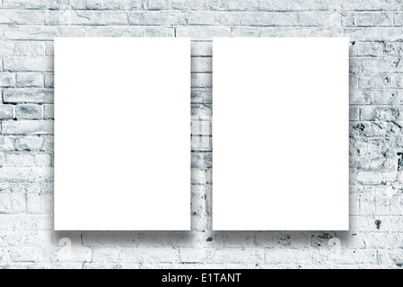 Blank paintings hanging on the art gallery wall. Paper size matches the international A2 format with vertical orientation. Stock Photo