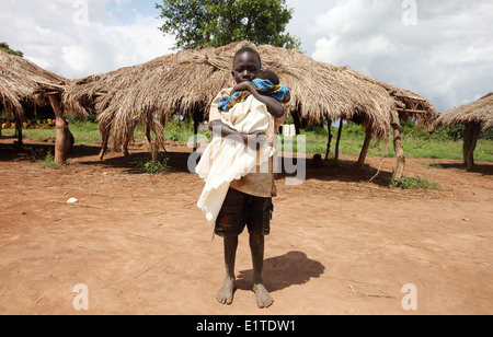 Two young children outside the village in the Lira district of northern Uganda. Stock Photo