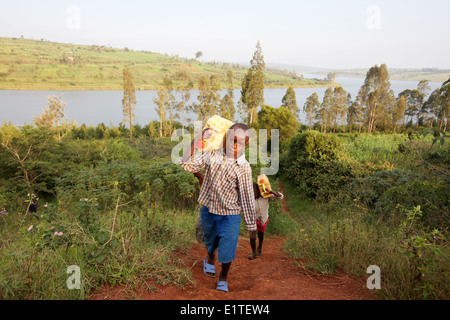 Children collect water in the Nyagatare district of Rwanda, east Africa Stock Photo