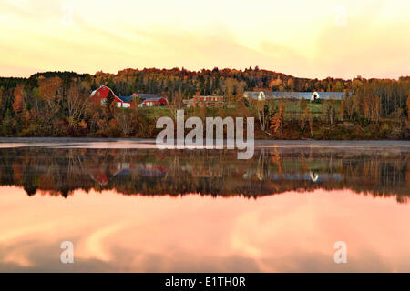 Farm at dusk on the Saint John River, Saint-Léonard, New Brunswick, Canada Stock Photo