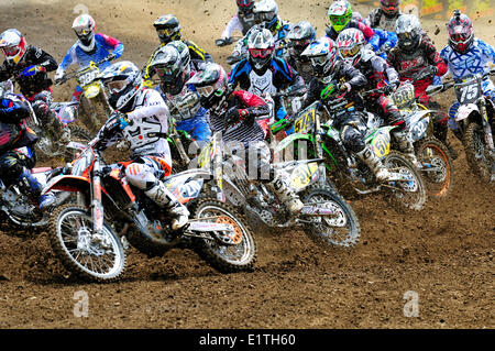 Motocross action at the start of the race during the Monster Energy Motocross Nationals at the Wastelands Track in Nanaimo, BC. Stock Photo