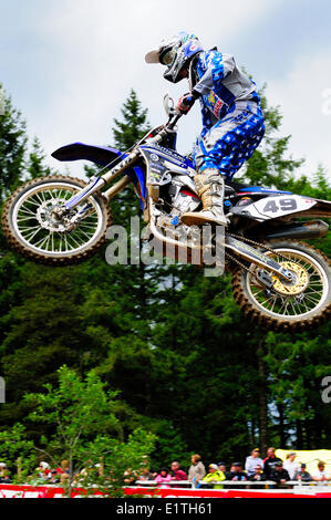 Motocross rider #49, Jared Stock, gets some air during a jump at the Monster Energy Motocross Nationals at the Wasteland track i Stock Photo