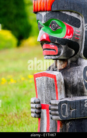 Memorial totem poles at the Namgis Burial Grounds, Alert Bay, Cormorant Island, near Vancouver Island in British Columbia. Stock Photo