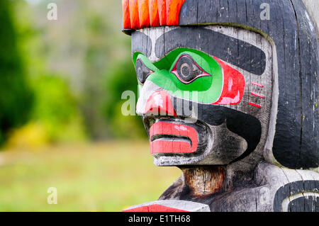 Memorial totem poles at the Namgis Burial Grounds, Alert Bay, Cormorant Island, near Vancouver Island in British Columbia. Stock Photo