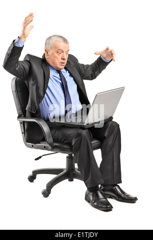 Shocked businessman having problems with his laptop Stock Photo