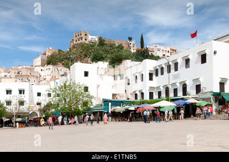 View of the local cafes and restaurants in the main square at the hilltop town of Moulay Idriss near  Meknes in  Morocco. Stock Photo