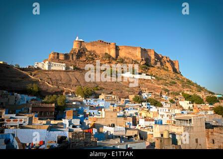Mehrangarh Fort at sunset sits above the 'Blue City' Jodhpur, Rajasthan State India Stock Photo