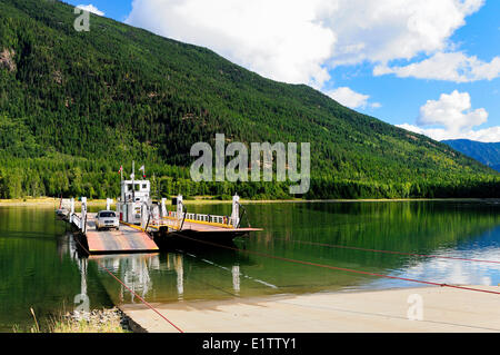 The Arrow Park Ferry, a cabled ferry, crosses Upper Arrow Lake near Nakusp, BC. Stock Photo