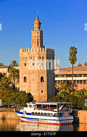 Torre del Oro (Tower Gold) which also houses the Museo Maritimo (Naval Museum) on the banks Rio Guadalquivir (River) El Arenal Stock Photo