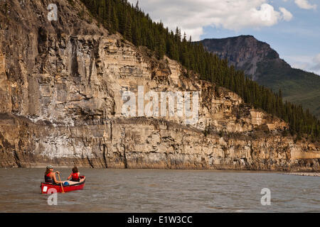 Mother and daughter canoe into  Second Canyon on Nahanni River, Nahanni National Park Preserve, NWT, Canada. Stock Photo