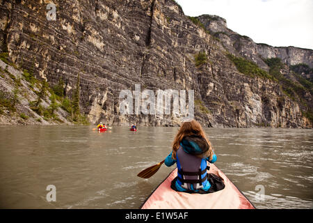 Three canoes in First Canyon on Nahanni River, Nahanni National Park Preserve, NWT, Canada. Stock Photo