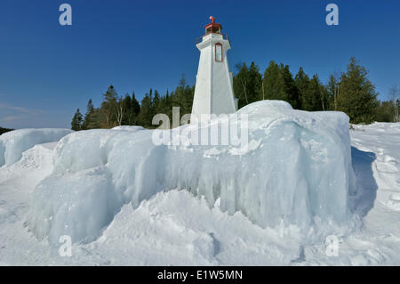 Big Tub lighthouse in winter on Georgian Bay, Tobermory, Ontario, Canada Stock Photo