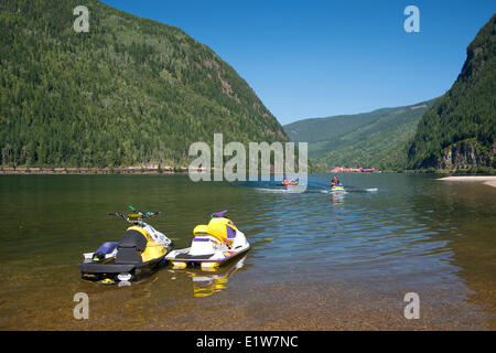 Personal watercraft on Three Valley Lake, Three Valley Lake Chateau resort in the background, Hwy #1, west of Revelstoke, Britis Stock Photo